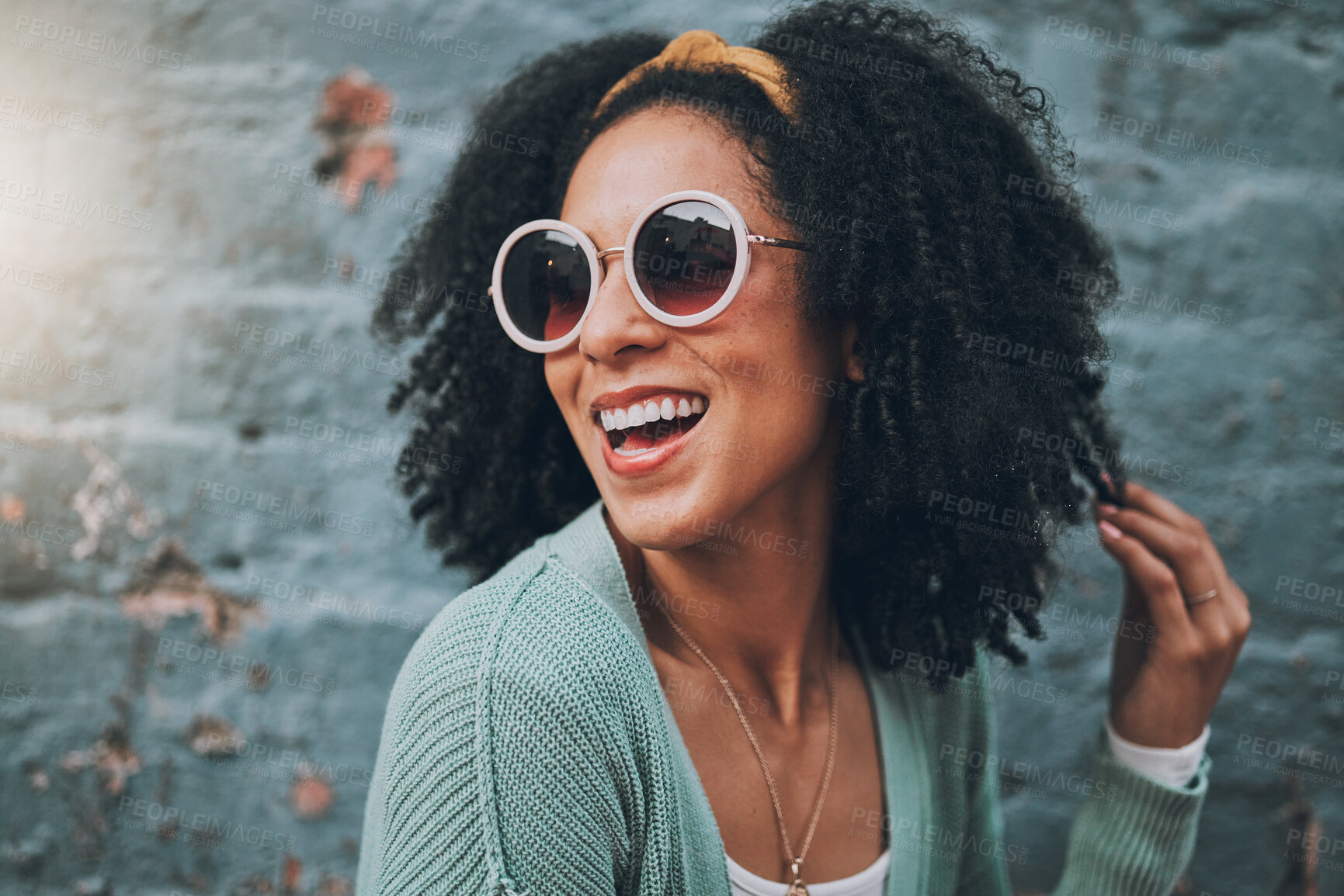 Buy stock photo Fashion, summer and black woman in city with beauty, sunglasses and smile by blue brick wall. Travel, adventure and girl with trendy outfit having fun on weekend, holiday and vacation in urban town