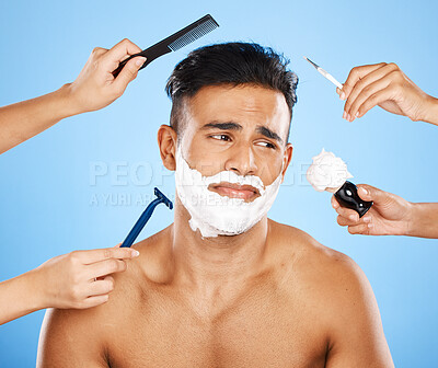 Buy stock photo Studio makeover, unhappy man and beauty by hands of professional stylist team grooming on a blue background mockup. Cleaning, hygiene and skincare with wellness model, new look and hand of assistance