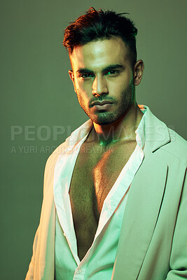 Buy stock photo Wellness, skincare and man in studio for beauty, grooming and neon, green and mockup on green background. Face, portrait and Mexican model relax, cool and sexy on creative mockup, space and aesthetic