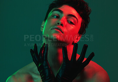 Buy stock photo Art, neon lights and creative portrait of man with leather gloves, serious face and self expression. Futuristic cyberpunk fashion, topless male model and artistic beauty on green studio background.