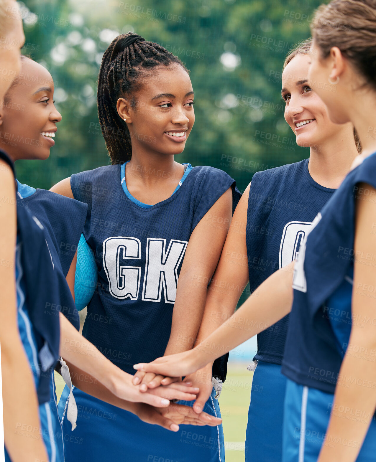 Buy stock photo Support, teamwork and sports with netball women for motivation, planning and training on field. Happy, vision and goals with diversity of friends hands in outdoor park for games, summer and workout 