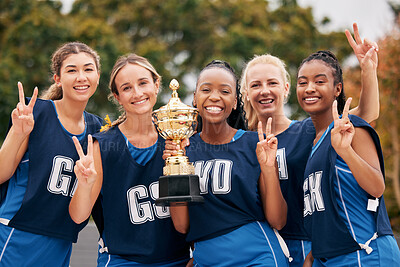 Buy stock photo Sports, netball and trophy with a woman team in celebration as a winner group of a victory or achievement. Peace, winning and teamwork with a female sport group celebrating success with a cup