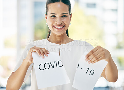 Buy stock photo Covid, sign and business woman at the end of the pandemic, happy and smile for freedom from virus at work. Excited, portrait and corporate employee tearing paper for free from corona in an office