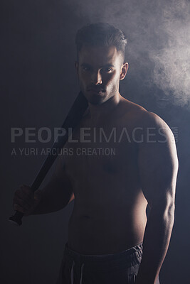 Baseball bat, fitness and man ready for a game on a black studio background. Sport, match and baseball player holding a bat ready to play sports on a dark backdrop for exercise, health and training