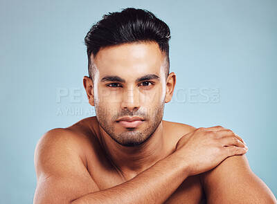 Buy stock photo Beauty, skincare and face portrait of man on blue studio background. Health, dermatology and wellness of male model from India with serious facial expression, beard hair or glowing and healthy skin.