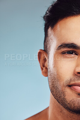 Buy stock photo skincare, beauty and face of man in studio portrait on blue mock up for healthcare, wellness and skin glow marketing, advertising or promotion space. Young model cosmetics mockup for beard skin care
