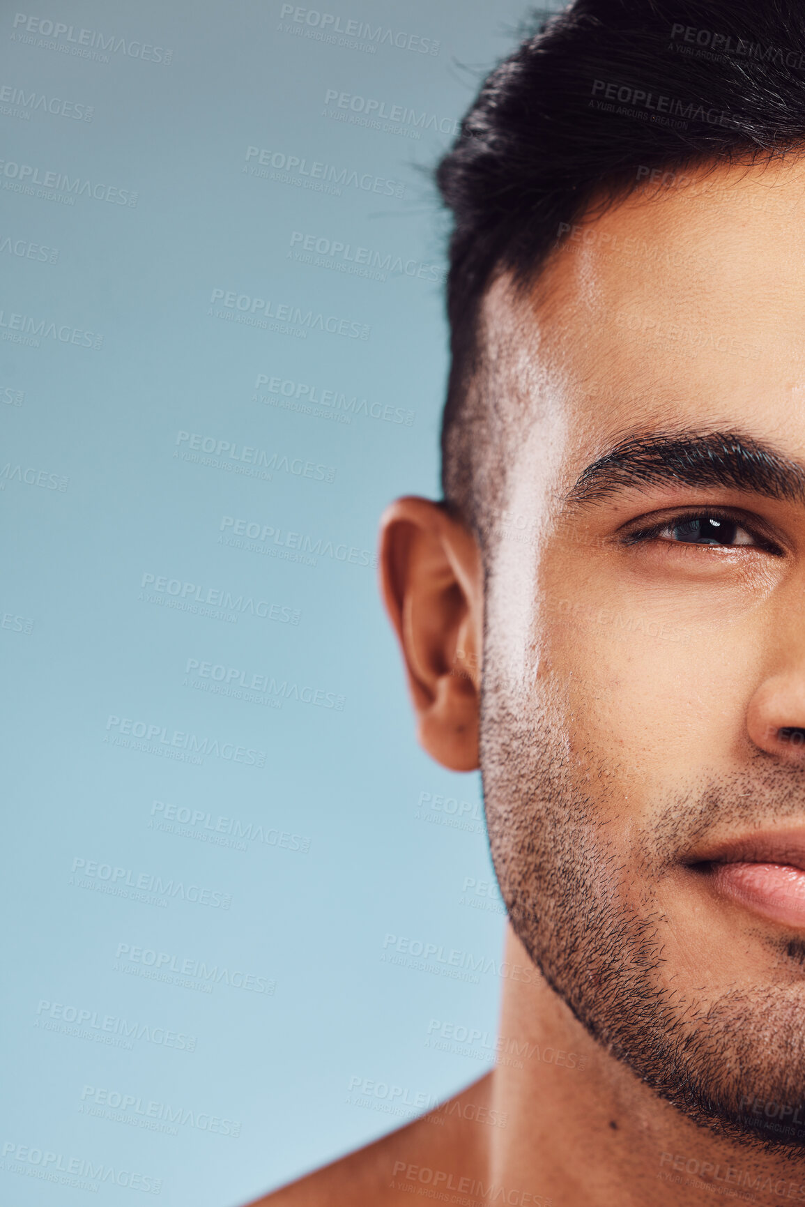 Buy stock photo skincare, beauty and face of man in studio portrait on blue mock up for healthcare, wellness and skin glow marketing, advertising or promotion space. Young model cosmetics mockup for beard skin care