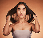 Beauty, hair and skin with woman in makeup portrait, natural cosmetic and hair care against orange studio background. Skincare, cosmetics treatment and hairstyle with wellness and keratin glow.