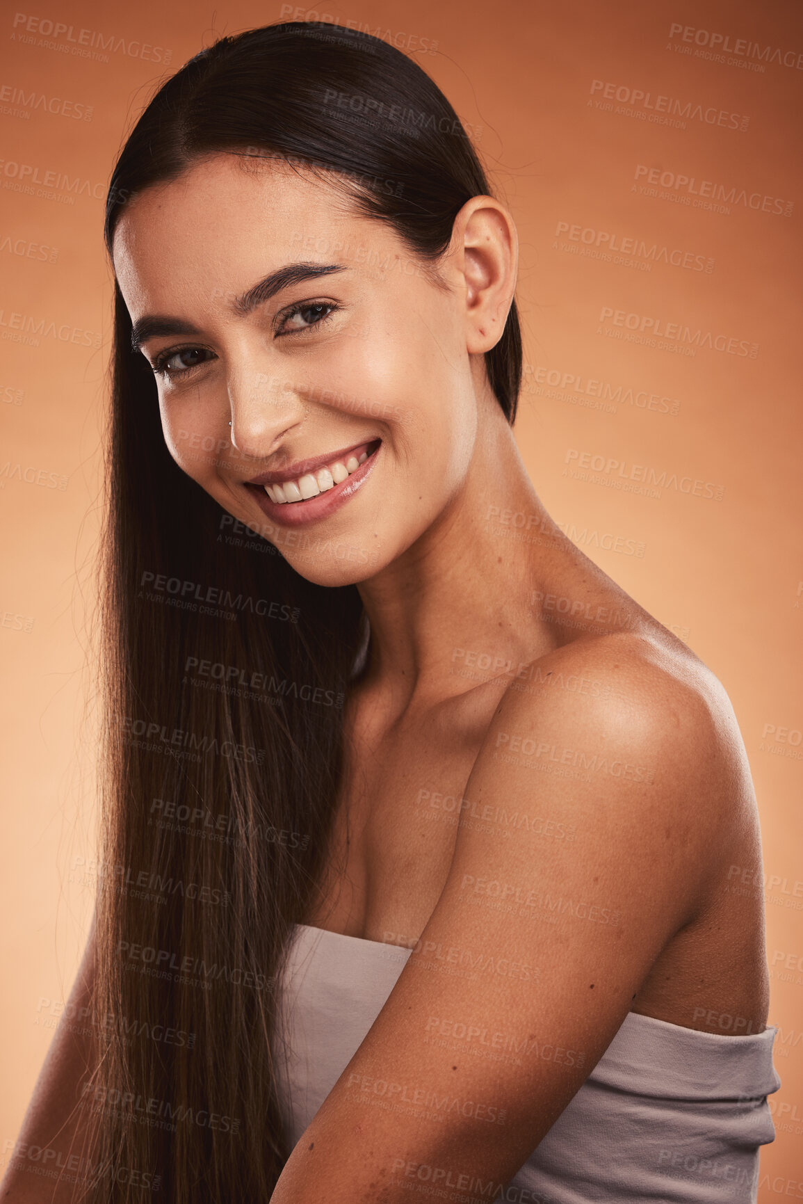 Buy stock photo Beauty, skincare and portrait of a woman with a smile in a studio with a natural face routine. Happy, cosmetics and young model from Brazil with facial or skin treatment isolated by orange background