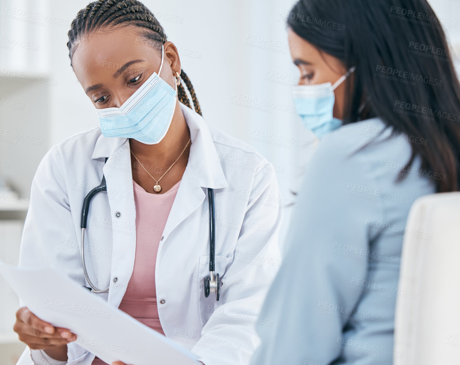 Buy stock photo Healthcare, covid and test results of patient woman in hospital with a black doctor wearing face mask during consultation, discussion and diagnosis. Female medical worker talking about covid 19 