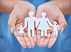 Cutout paper family, woman hands for security and safety together for insurance help. Abstract mom, dad and kids in cut out picture for future, collaboration and protection support in community trust