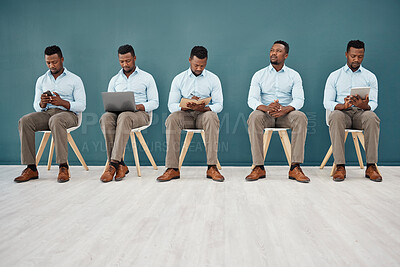 Buy stock photo Interview, hiring and waiting with a black man in business sitting in line for a meeting with human resources. HR, recruitment and opportunity with a male employee on the search for a new job