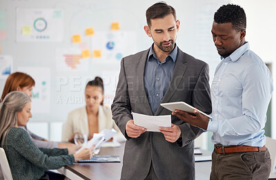 Buy stock photo Consulting mentor, business men with a tablet and office employees work on creative design, digital marketing and advertising strategy. Corporate leadership, brainstorming meeting and a startup team 