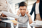 Businessman, stress and overwhelmed with headache, burnout or workload from colleagues at the office. Corporate man multi tasking suffering from mental health issues, overworked or tired at workplace