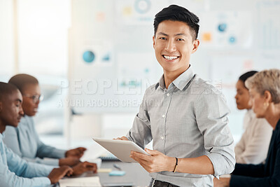 Buy stock photo Workshop, portrait and businessman with a tablet in a meeting for planning, strategy and collaboration at work. Smile, digital and corporate Asian worker typing on technology during a seminar
