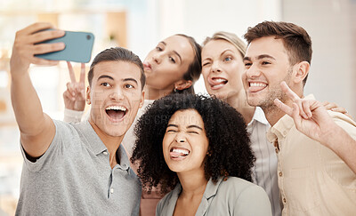 Buy stock photo Phone, selfie and work friends with funny faces at team building event or meeting in office. Comic, diversity and goofy business people in collaboration having fun and taking picture in the workplace