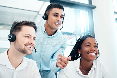 Buy stock photo Call center manager, mentor or coach giving advice and helping team while reading feedback on computer and wearing headset. Telemarketing, customer service and CRM men and woman talking for support