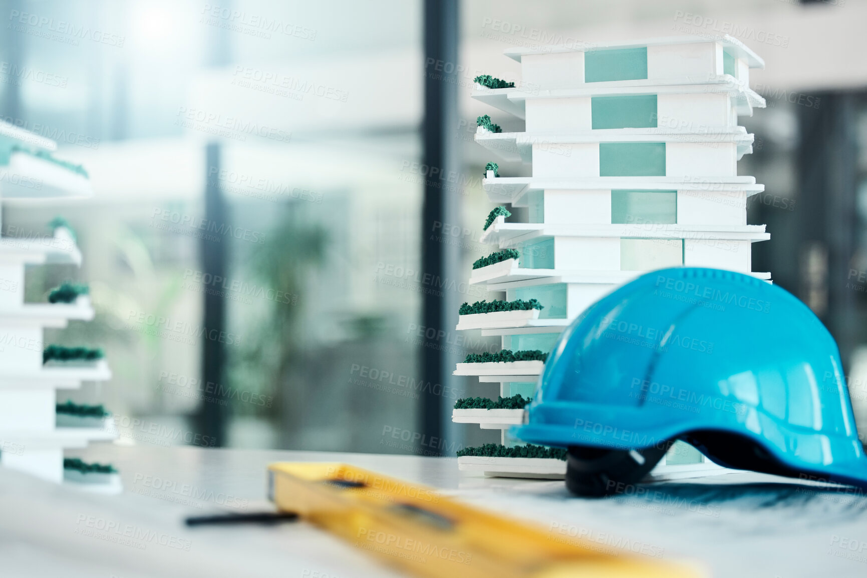 Buy stock photo Building model on table, construction design industry and safety helmet for industrial real estate job. 3d plastic apartment architecture project, engineering career and contractor equipment tools