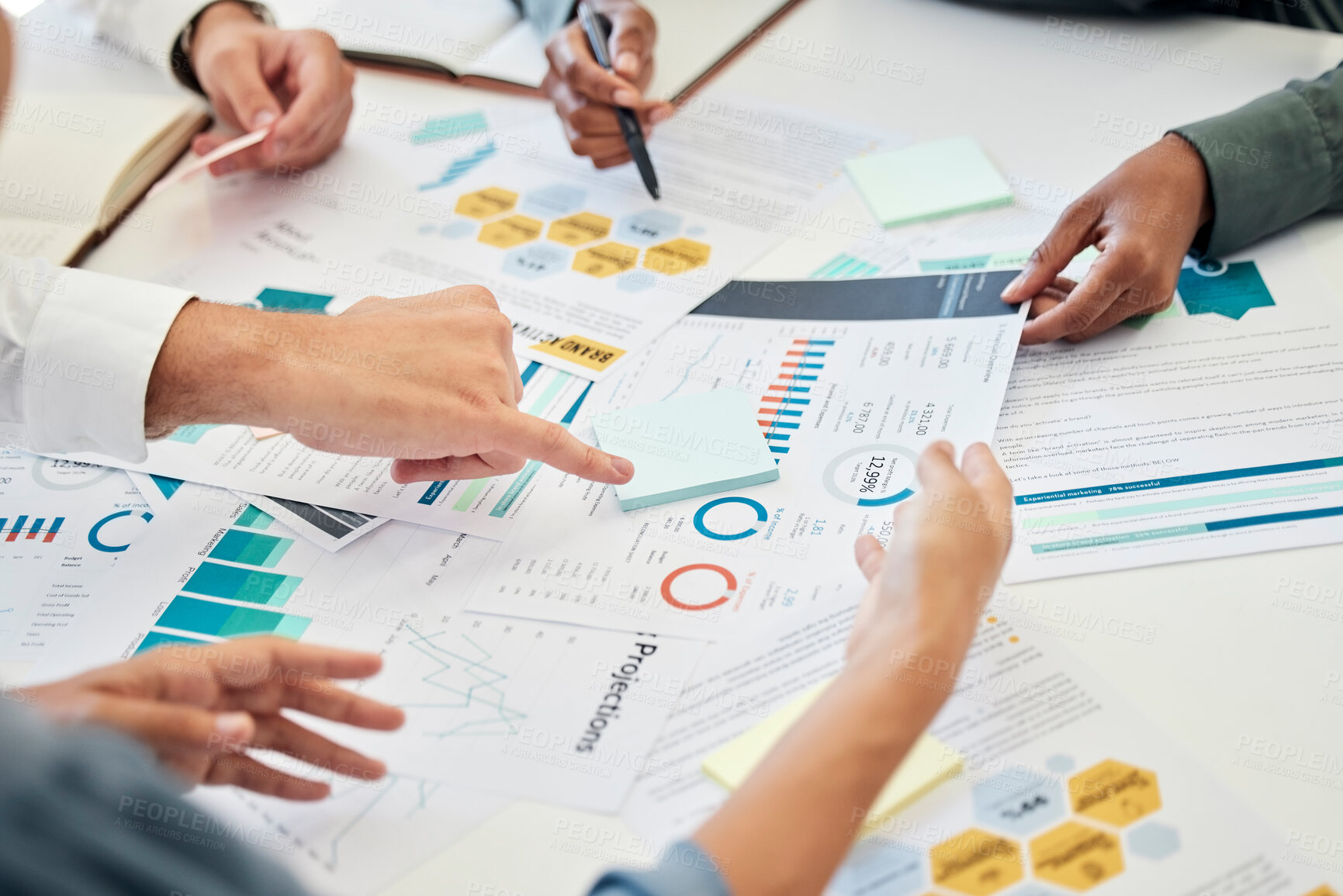 Buy stock photo Marketing documents, teamwork and hands of business people in office at table discussing global sales growth strategy. Graphs, charts or group in meeting with finance statistics for project planning
