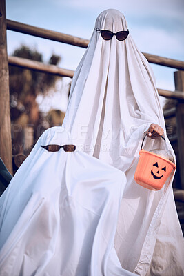Buy stock photo Halloween, friends and ghost costume for fun, festival and celebration while bonding at park, happy and cool. Spooky, dress up and event with people in horror, fantasy and glasses while celebrating