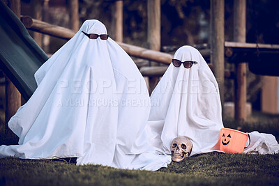 Buy stock photo Halloween, glasses and people in ghost costume for trick or treat, global dress up day or fun on playground grass field. Fear fantasy, horror and relax friends role play scary phantom monster at park