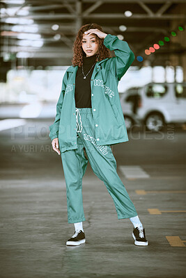 Buy stock photo Urban, fashion and girl portrait at parking lot in New York with edgy athleisure style. Gen Z, trendy and statement  clothes of young city woman with assertive, confident and cool pose.

