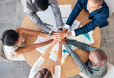 Buy stock photo Hands, teamwork and motivation with a business team sitting at a table in a boardroom from above. Collaboration, meeting and unity with an employee group working on finance or accounting documents