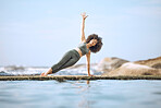 Yoga, balance and black woman exercise at the beach, fitness outdoor with zen and body training. Mindfulness, workout out in nature and ocean, freedom and health, active life with wellness motivation