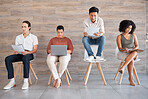 Interview, recruitment and hiring with an applicant group waiting in line for a meeting with human resources. Diversity, resume and opportunity with business man and woman staff sitting in a row