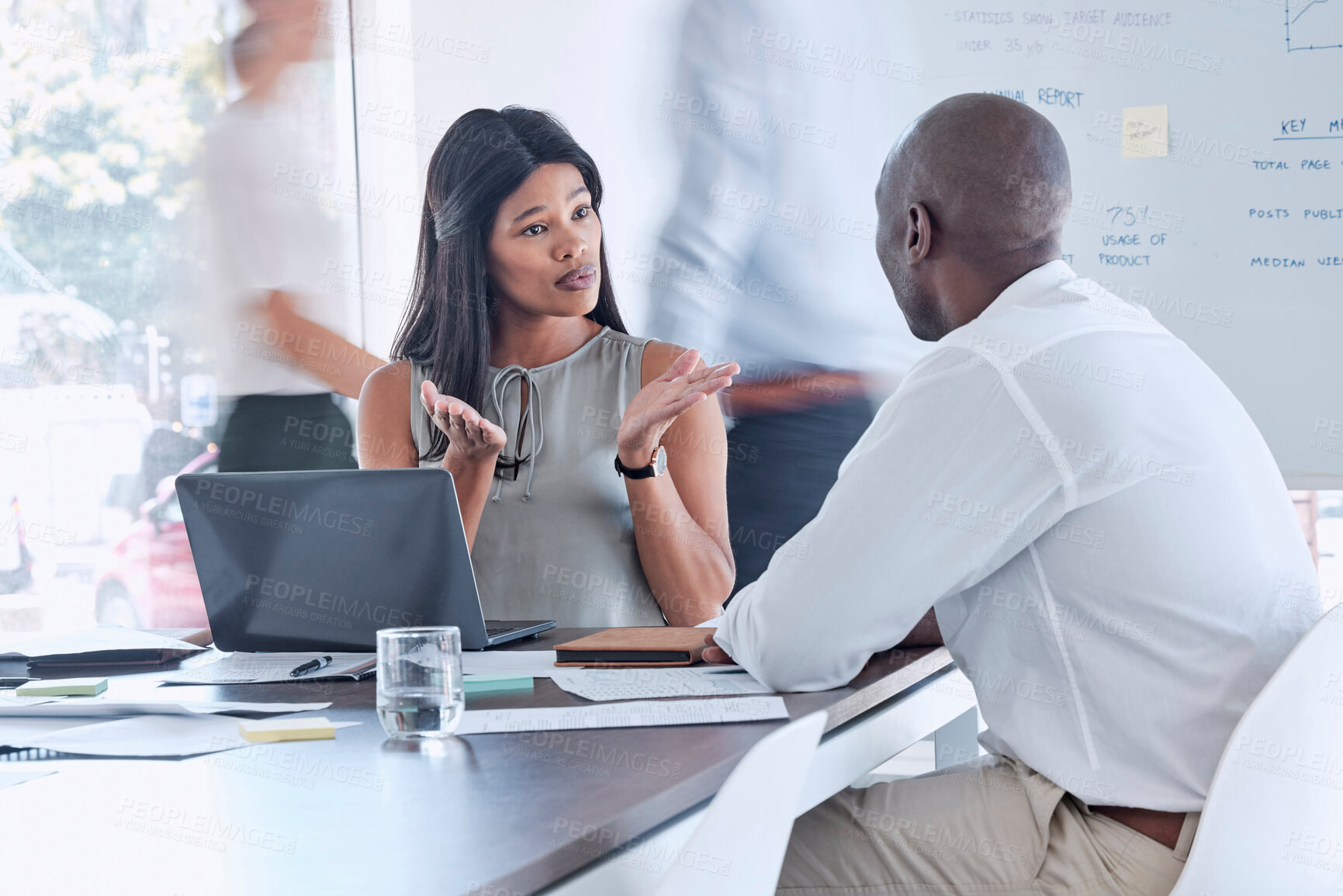 Buy stock photo Black woman talking to employee in business meeting, planning and discussion of ideas, mission and strategy in busy corporate office. Entrepreneur speaking, working and communication with employee 