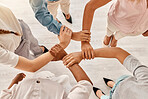 Office, employee diversity and hands together of business workers showing support, trust and hope. Above view of corporate staff holding arms ready for working on collaboration, teamwork and project