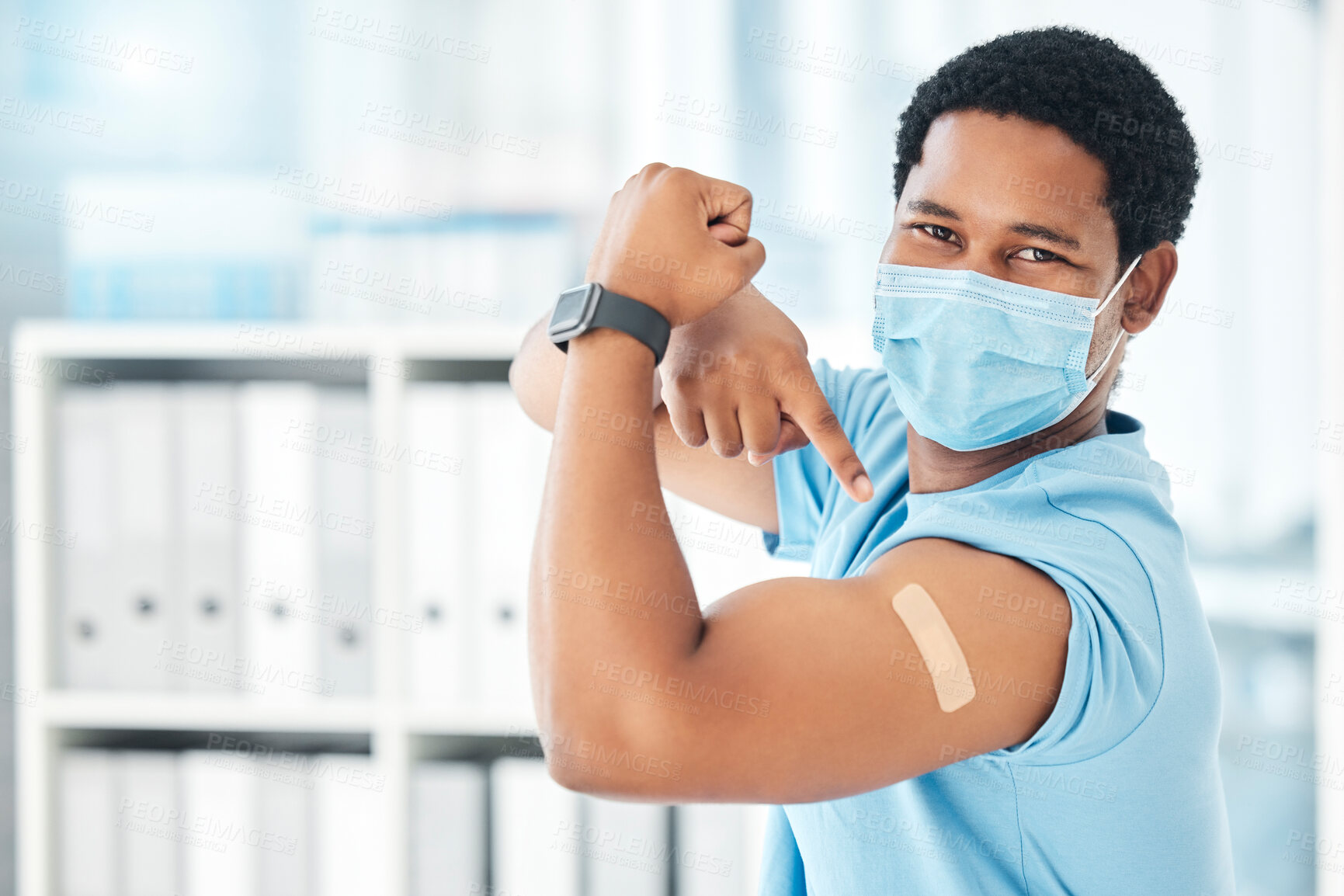 Buy stock photo Man, covid face mask or muscle flex in hospital, clinic or pharmacy with vaccine plaster, bacteria medicine or healthcare trust. Portrait, black person or pointing at covid 19 band aid in compliance
