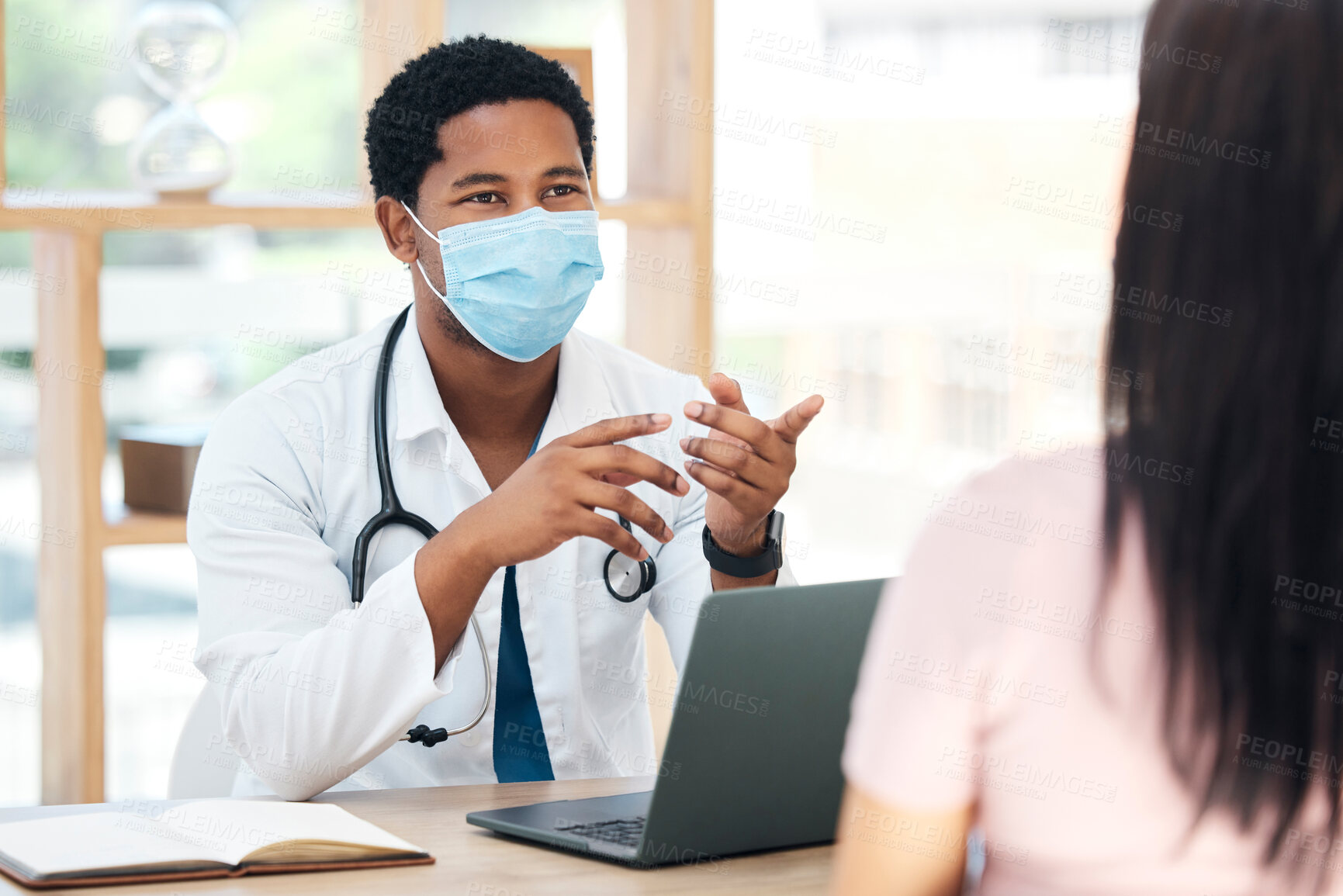 Buy stock photo Covid, laptop and doctor consulting patient for vaccine advice, healthcare corona virus results and check exam report in a hospital office. Covid 19 medical black man expert talking in consultation