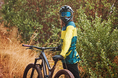 Buy stock photo Mountain bike man with cycling helmet taking a break from adventure, action sports and freedom on off road, nature and dirt path. Bicycle athlete stop outdoors after training, workout and biker race 