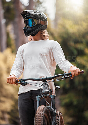 Buy stock photo Biker, mountain bike and competition outdoor for extreme sports, helmet and have fun in summer, sunlight and in nature. Young man, athlete and bicycle with head gear for safety, protection and glare
