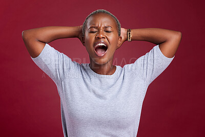 Buy stock photo Screaming black woman, angry in studio with hands behind head and sad stress by wall for mental health. Woman frustrated, shouting depression anxiety in grief and moody face anger with red background