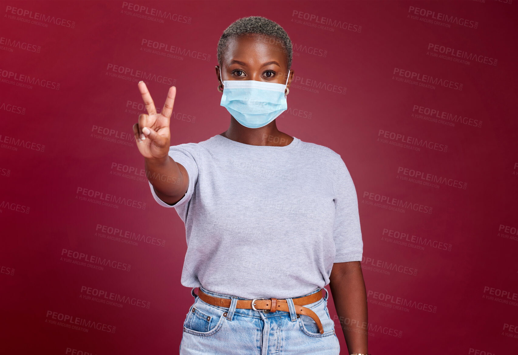 Buy stock photo Black woman, covid face mask or peace sign on red background in studio healthcare vote, wellness opinion or compliance solidarity. Portrait, covid 19 or cool hand gesture on advertising mock up space