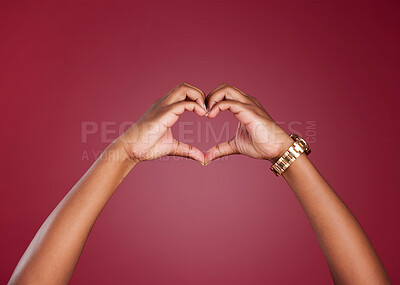 Buy stock photo Hands, heart and sign for love, care or relationship in romance against a studio background. Hand in hearty emoji, shape or symbol for romantic gesture, valentines day or emotion on copy space
