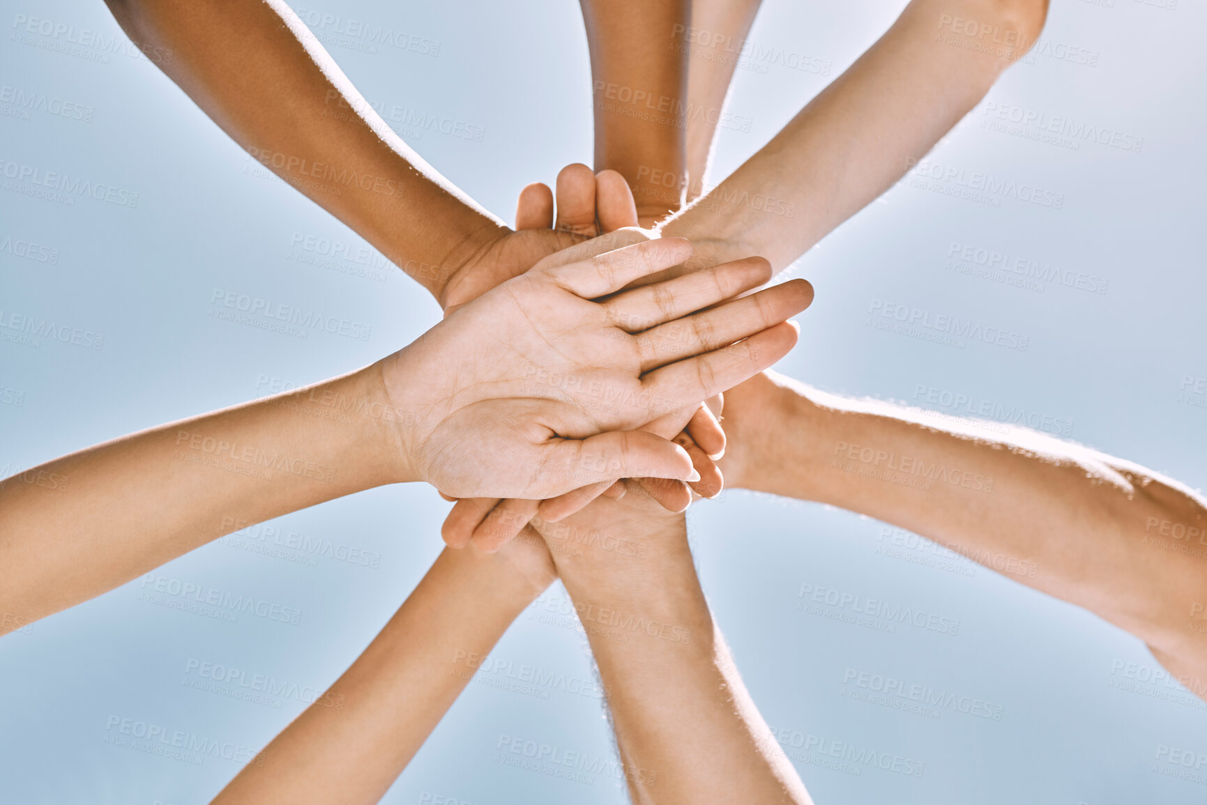 Buy stock photo Below hands stack, group motivation support and trust together outdoor with blue sky. Team hand pile, teamwork vision and solidarity unity friends for community collaboration for people in diversity