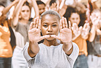 Protest, stop hands and black woman with people 
fighting for peace, end to racial discrimination or freedom. Politics, justice or rally, activism or group demand social change or human rights.



