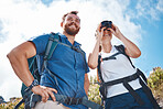Hiking couple, woman using binoculars and adventure happy together with nature sky on travel. Smile outdoor man, backpack girl happiness and summer trekking holiday on freedom journey in Cape Town