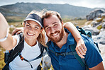 Hiking, happy and couple taking a selfie by a mountain in nature while walking or trekking with freedom in Canada. Smile, memory and healthy woman loves taking pictures when traveling on fun holidays