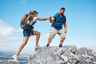 Buy stock photo Helping hand, couple climbing or hiking mountain in nature on vacation, holiday or trip. Freedom, rescue support and traveling man and woman outdoors in countryside rock climbing, exercise or workout