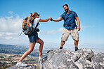 Help, couple or friends hiking on mountain in nature with a smile or training. Travel, adventure and trekking workout man and woman on an outdoor, countryside or rock climbing, exercise and support
