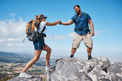 Buy stock photo Help, couple or friends hiking on mountain in nature with a smile or training. Travel, adventure and trekking workout man and woman on an outdoor, countryside or rock climbing, exercise and support