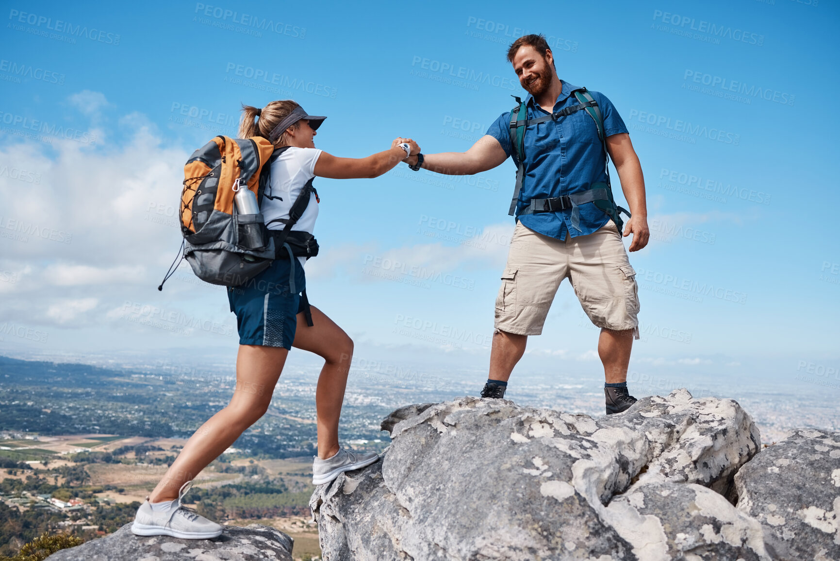 Buy stock photo Help, couple or friends hiking on mountain in nature with a smile or training. Travel, adventure and trekking workout man and woman on an outdoor, countryside or rock climbing, exercise and support