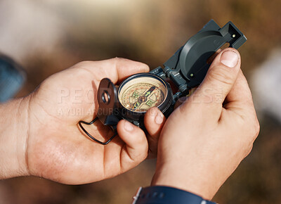 Buy stock photo Hands, compass and travel for direction, map or location in adventure, hike or navigation in the outdoors. Hand of traveler holding tracker for scope, tourism or hiking in exploration for journey