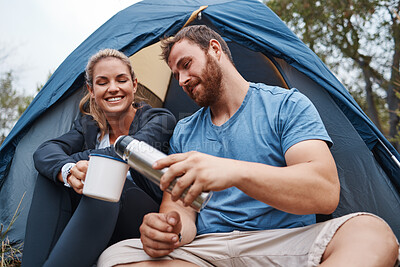 Buy stock photo Camping, coffee and love with a couple in a tent, drinking from a flask while hiking together in nature. Tea, summer and relax with a man and woman in the natural mountains for bonding or adventure