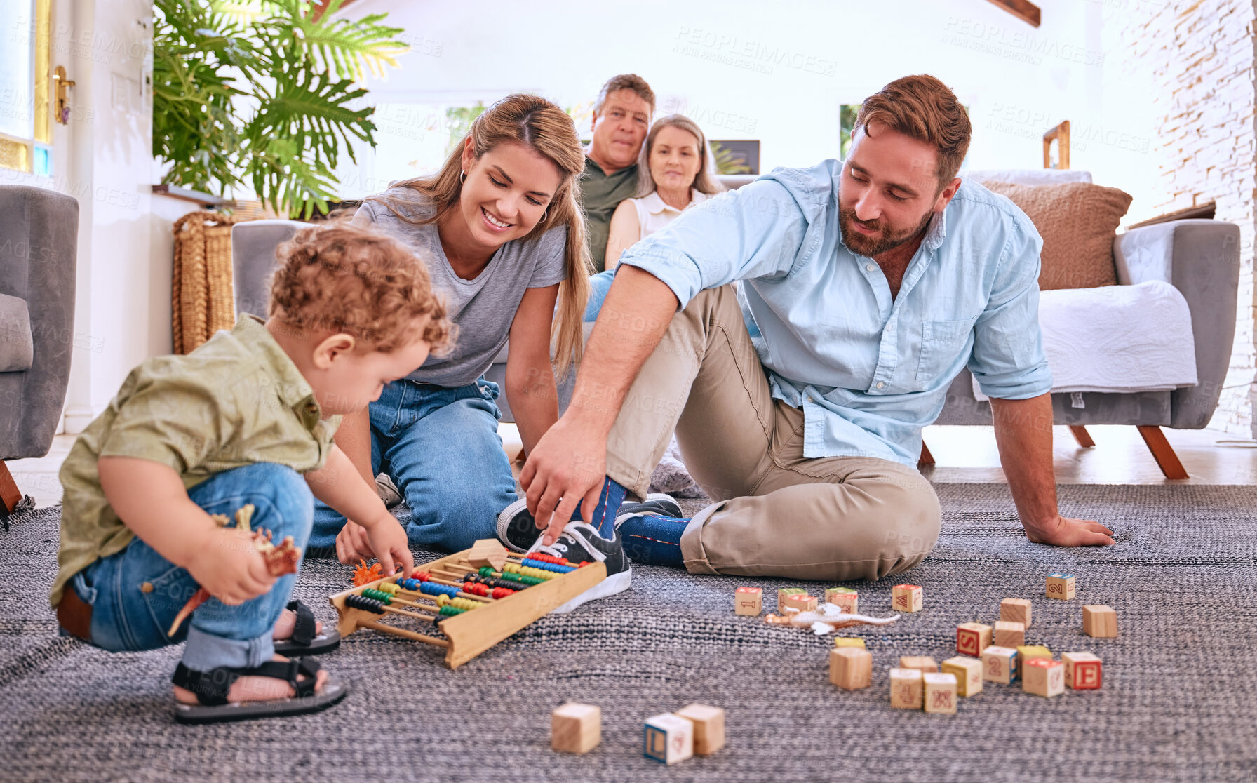 Buy stock photo Parents, learning and child playing with toys for education and development at home. Motor skills, childhood education and little boy playing with abacus with mother and father for bonding and care