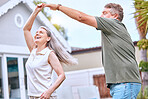 Senior couple, dancing and happy retirement in summer backyard garden for romance, quality time or relax together. Elderly man, smile woman and dance for anniversary, love and joy celebration outdoor
